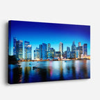 Cuadro canvas Ciudad Costera Nocturna Azul - Ciudades Urbano y Arquitectura - Vista Perspectiva